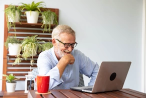 Life Assure Senior Woman Sitting In Chair And Laughing With Caregiver Nurse Blog